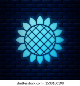 Glowing neon Sunflower icon isolated on brick wall background.  Vector Illustration