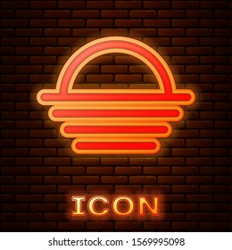 Glowing neon Sunset icon isolated on brick wall background.  Vector Illustration