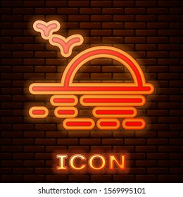 Glowing neon Sunset icon isolated on brick wall background.  Vector Illustration
