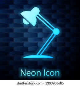 Glowing neon Table lamp icon isolated on brick wall background. Table office lamp. Vector Illustration