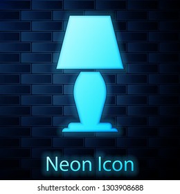 Glowing neon Table lamp icon isolated on brick wall background. Vector Illustration