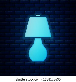 Glowing neon Table lamp icon isolated on brick wall background.  Vector Illustration