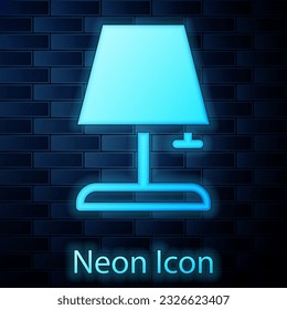 Glowing neon Table lamp icon isolated on brick wall background.  Vector