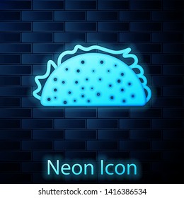 Glowing neon Taco with tortilla icon isolated on brick wall background. Traditional mexican fast food. Vector Illustration