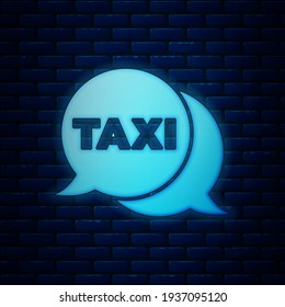 Glowing neon Taxi call telephone service icon isolated on brick wall background. Speech bubble symbol. Taxi for smartphone.  Vector