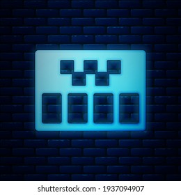 Glowing neon Taximeter device icon isolated on brick wall background. Measurement appliance for passenger fare in taxi car.  Vector