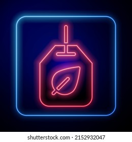 Glowing neon Tea bag with leaf icon isolated on black background.  Vector
