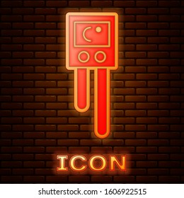 Glowing neon Temperature and humidity sensor icon isolated on brick wall background.  Vector Illustration