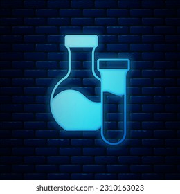 Glowing neon Test tube and flask chemical laboratory test icon isolated on brick wall background. Laboratory glassware sign.  Vector