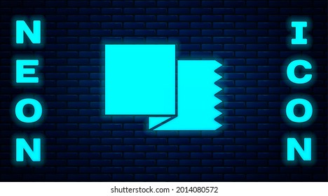 Glowing neon Textile fabric roll icon isolated on brick wall background. Roll, mat, rug, cloth, carpet or paper roll icon.  Vector