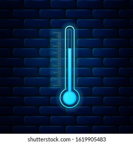 Glowing neon Thermometer icon isolated on brick wall background.  Vector Illustration
