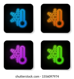 Glowing neon Thermometer with snowflake icon isolated on white background. Black square button. Vector Illustration