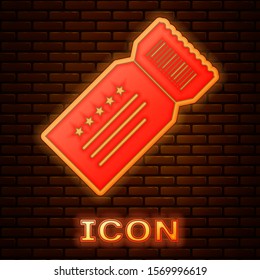 Glowing neon Ticket icon isolated on brick wall background.  Vector Illustration