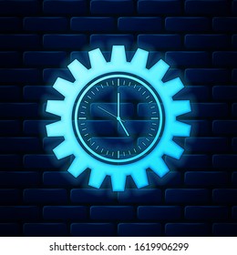Glowing neon Time Management icon isolated on brick wall background. Clock and gear sign. Productivity symbol.  Vector Illustration