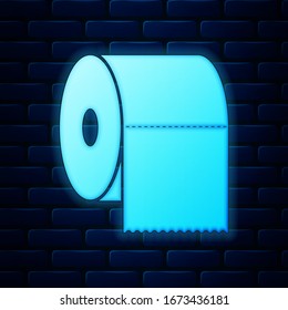 Glowing neon Toilet paper roll icon isolated on brick wall background.  Vector Illustration