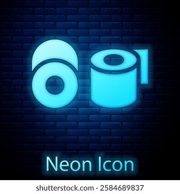 Glowing neon Toilet paper roll icon isolated on brick wall background.  Vector