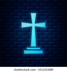Glowing neon Tombstone with cross icon isolated on brick wall background. Grave icon.  Vector Illustration