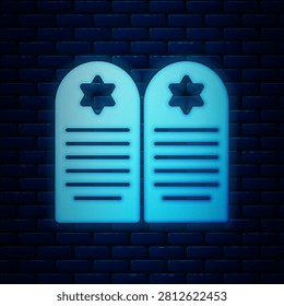 Glowing neon Tombstone with star of david icon isolated on brick wall background. Jewish grave stone. Gravestone icon.  Vector