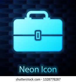 Glowing neon Toolbox icon isolated on brick wall background. Tool box sign. Vector Illustration