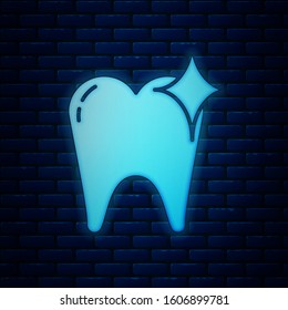 Glowing neon Tooth whitening concept icon isolated on brick wall background. Tooth symbol for dentistry clinic or dentist medical center.  Vector Illustration