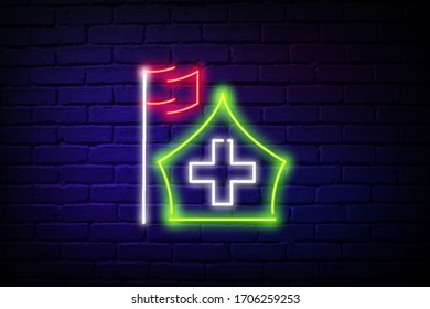 A glowing neon tourist or army tent with a hospital badge isolated from a brick wall. Symbol of camping, war game. Alphabet of neon light. vector illustration