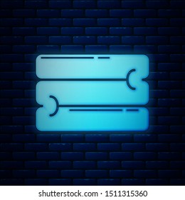 Glowing neon Towel stack icon isolated on brick wall background.  Vector Illustration