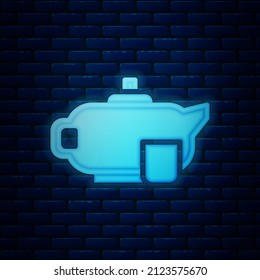 Glowing neon Traditional tea ceremony icon isolated on brick wall background. Teapot with cup.  Vector