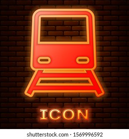 Glowing neon Train icon isolated on brick wall background. Public transportation symbol. Subway train transport. Metro underground.  Vector Illustration