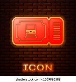 Glowing neon Train ticket icon isolated on brick wall background. Travel by railway.  Vector Illustration