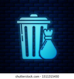 Glowing neon Trash can and garbage bag icon isolated on brick wall background. Garbage bin sign. Recycle basket icon. Office trash icon.  Vector Illustration