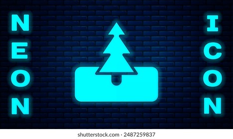 Glowing neon Tree icon isolated on brick wall background. Forest symbol.  Vector