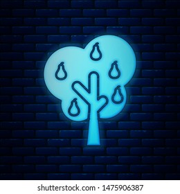 Glowing neon Tree with pears icon isolated on brick wall background. Agricultural plant. Organic farm product. Gardening theme.  Vector Illustration