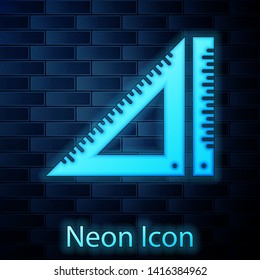 Glowing neon Triangular ruler icon isolated on brick wall background. Straightedge symbol. Geometric symbol.  Vector Illustration