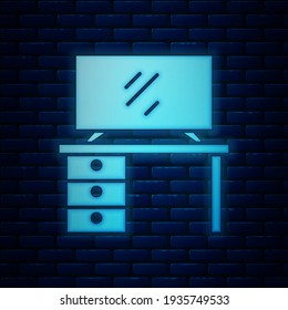 Glowing neon TV table stand icon isolated on brick wall background.  Vector