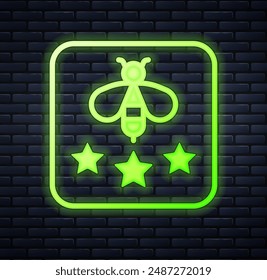 Glowing neon Type of bee icon isolated on brick wall background. Sweet natural food. Honeybee or apis with wings symbol. Flying insect.  Vector