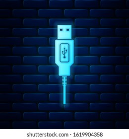 Glowing neon USB cable cord icon isolated on brick wall background. Connectors and sockets for PC and mobile devices. Computer peripherals connector or smartphone recharge supply.  Vector Illustration