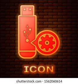 Glowing neon USB flash drive and gear icon isolated on brick wall background. Adjusting app, service concept, setting options, maintenance, repair, fixing.  Vector Illustration