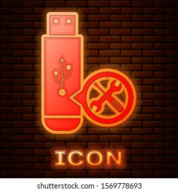 Glowing neon USB flash drive with screwdriver and wrench icon isolated on brick wall background. Adjusting, service, setting, maintenance, repair, fixing.  Vector Illustration