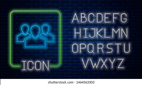Glowing neon Users group icon isolated on brick wall background. Group of people icon. Business avatar symbol - users profile icon. Neon light alphabet. Vector Illustration