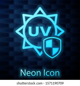 Glowing neon UV protection icon isolated on brick wall background. Sun and shield. Ultra violet rays radiation. SPF sun sign.  Vector Illustration