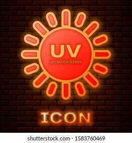 Glowing neon UV protection icon isolated on brick wall background. Ultra violet rays radiation. SPF sun sign.  Vector Illustration