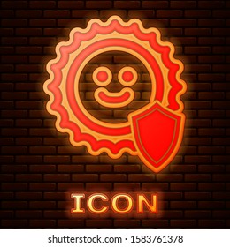 Glowing neon UV protection icon isolated on brick wall background. Sun and shield. Ultra violet rays radiation. SPF sun sign.  Vector Illustration