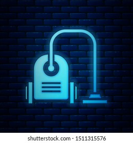 Glowing neon Vacuum cleaner icon isolated on brick wall background.  Vector Illustration