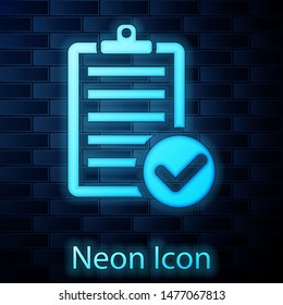 Glowing neon Verification of delivery list clipboard and pen icon isolated on brick wall background.  Vector Illustration