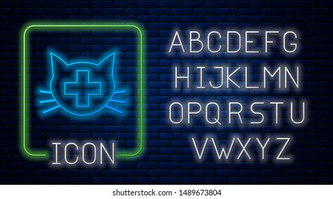 Glowing neon Veterinary clinic symbol icon isolated on brick wall background. Cross with cat veterinary care. Pet First Aid sign. Neon light alphabet. Vector Illustration