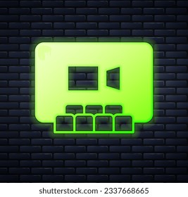 Glowing neon Video chat conference icon isolated on brick wall background. Online meeting work form home. Remote project management.  Vector