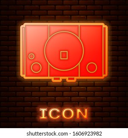 Glowing neon Video game console icon isolated on brick wall background.  Vector Illustration