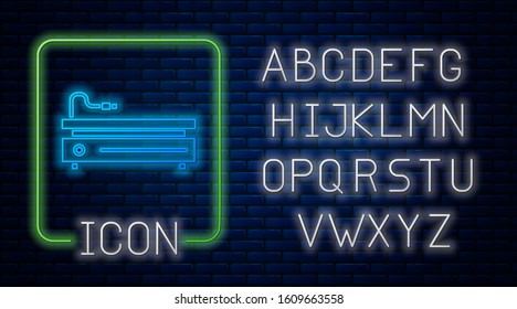 Glowing neon Video game console icon isolated on brick wall background. Neon light alphabet. Vector Illustration