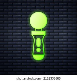 Glowing neon VR controller game icon isolated on brick wall background. Virtual reality experience, sensation of presence, position-tracking technology device.  Vector