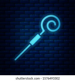 Glowing neon Walking stick icon isolated on brick wall background. Happy Saint Patricks day.  Vector Illustration